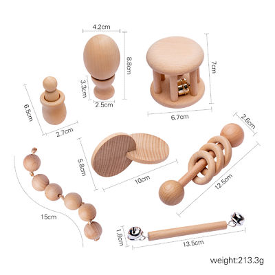 Γραφικά κουδουνίσματα 7Pc ξύλινο Teether για το ξύλινο δαχτυλίδι οδοντοφυΐας μωρών